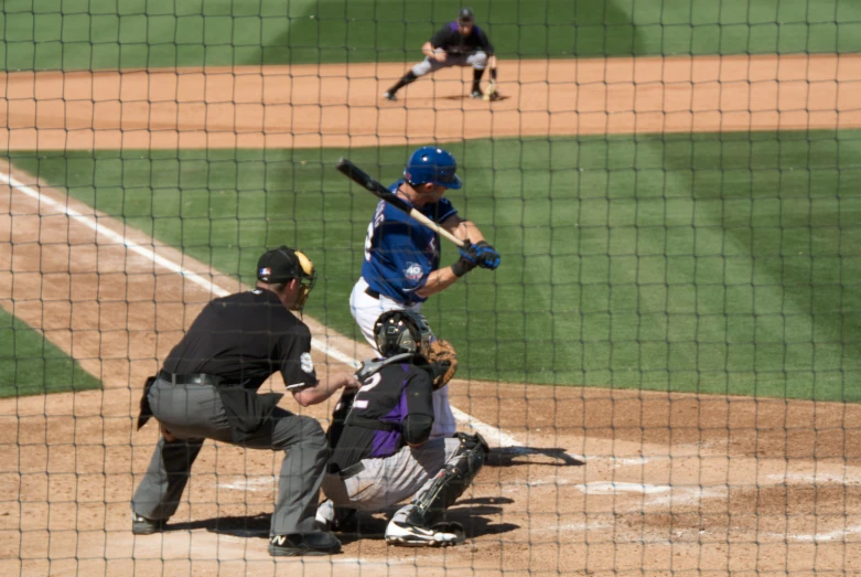 a batter, catcher and umpire during a baseball game