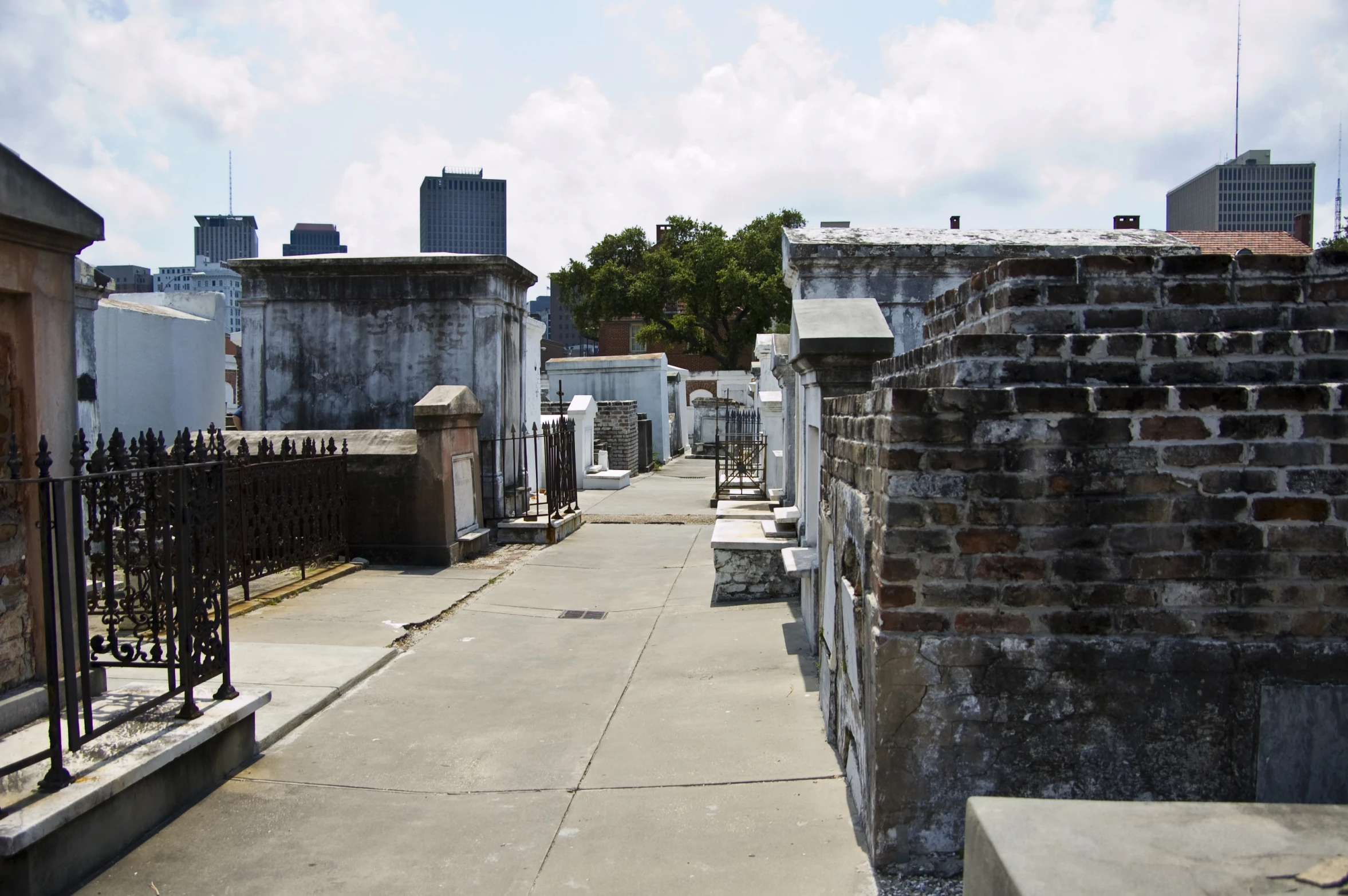 a view down an alley way of many graves