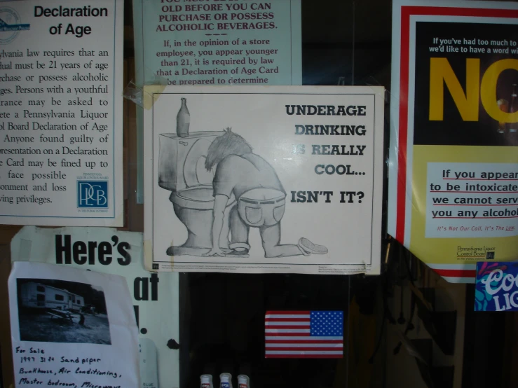 an old public toilet ad is posted on a wall