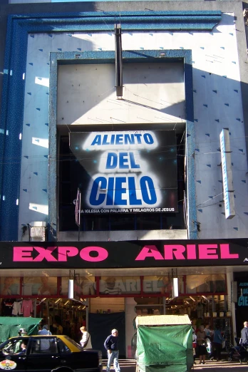 an entrance to a store under a big sign
