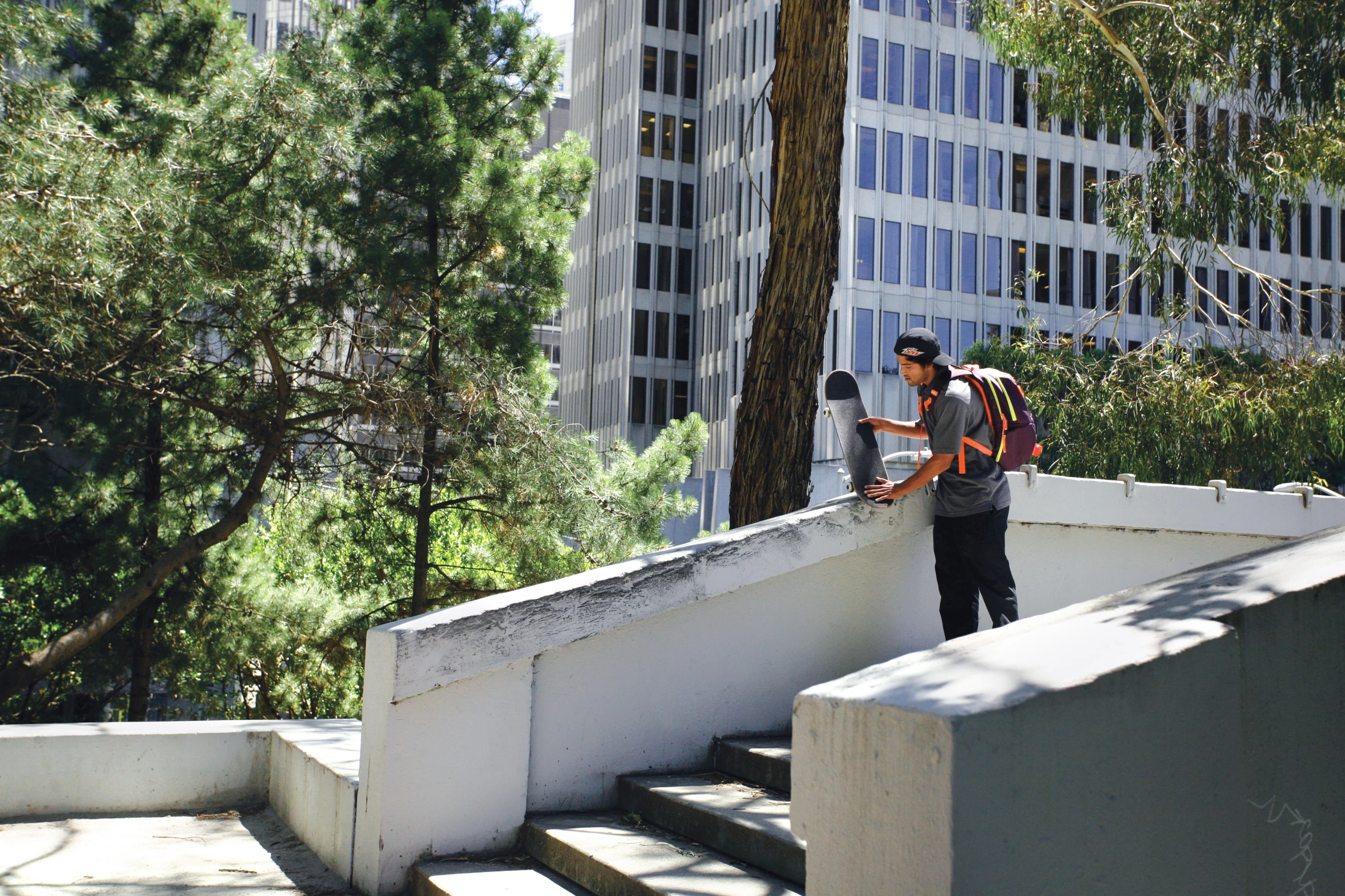 a man that is standing on a railing