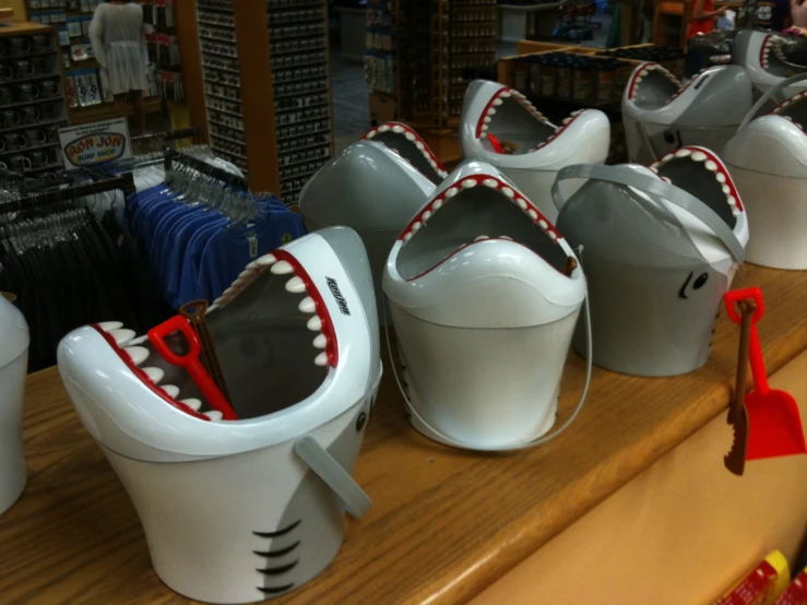 a store shelf with various sculptures of toothpastes and scissors