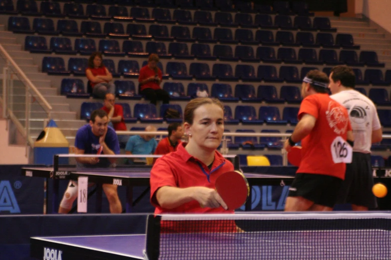 a woman with a racket in her hands playing tennis