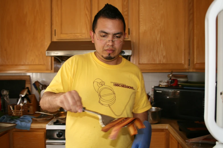 a man is slicing up a carrot with a knife