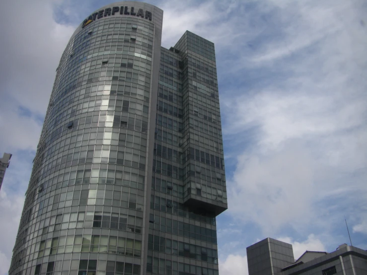 some very tall buildings against the blue sky