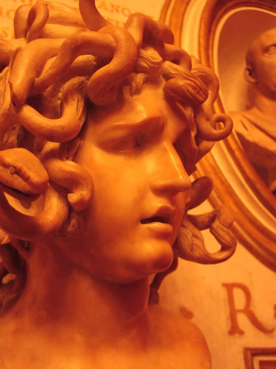 a statue with curly hair in a large room