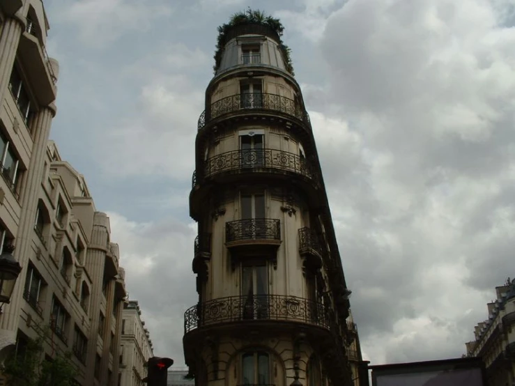 a building with an iron railing with balconyes and balconies