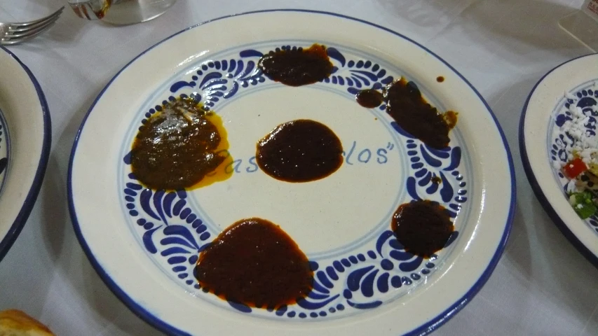 plates topped with different types of food and various sauces