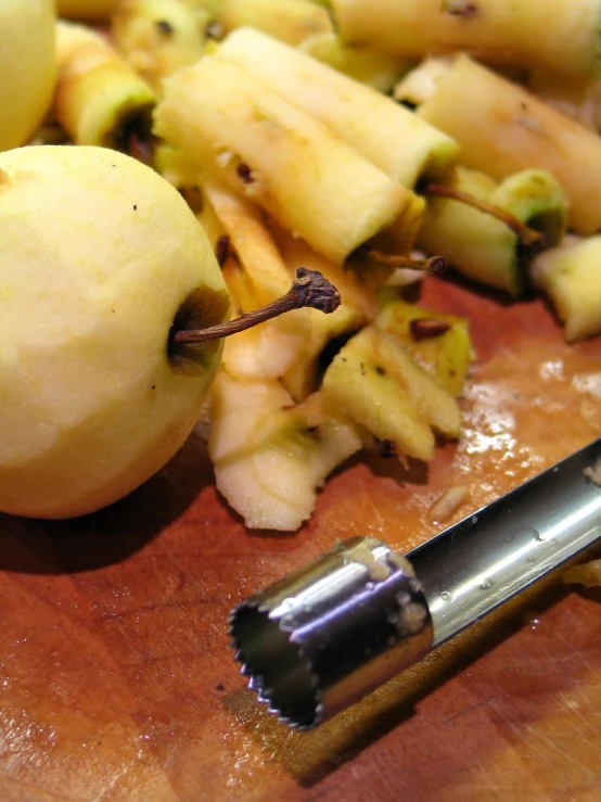 some pieces of fruit on a  board and an apple peel