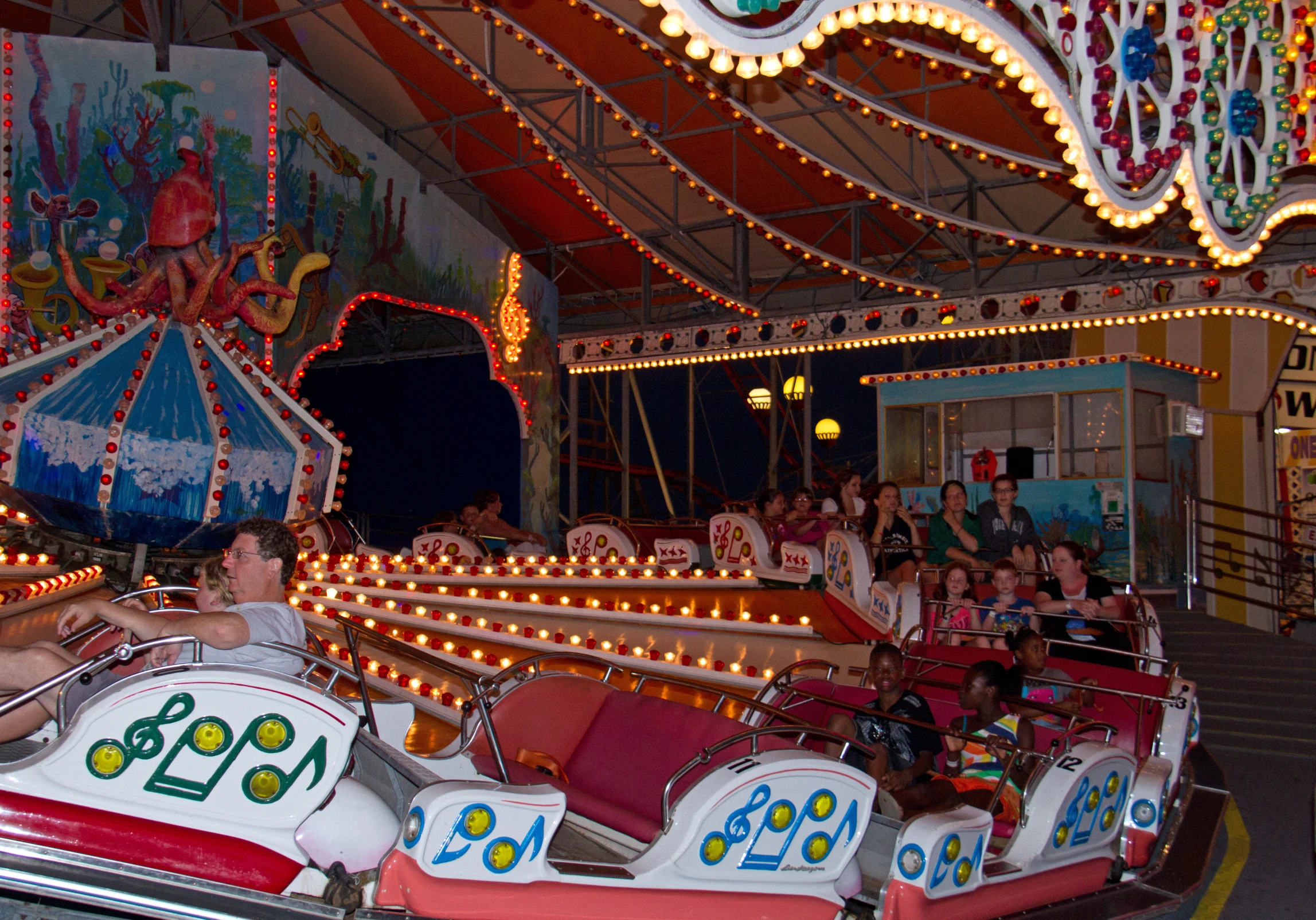 a woman rides a ride in a carnival