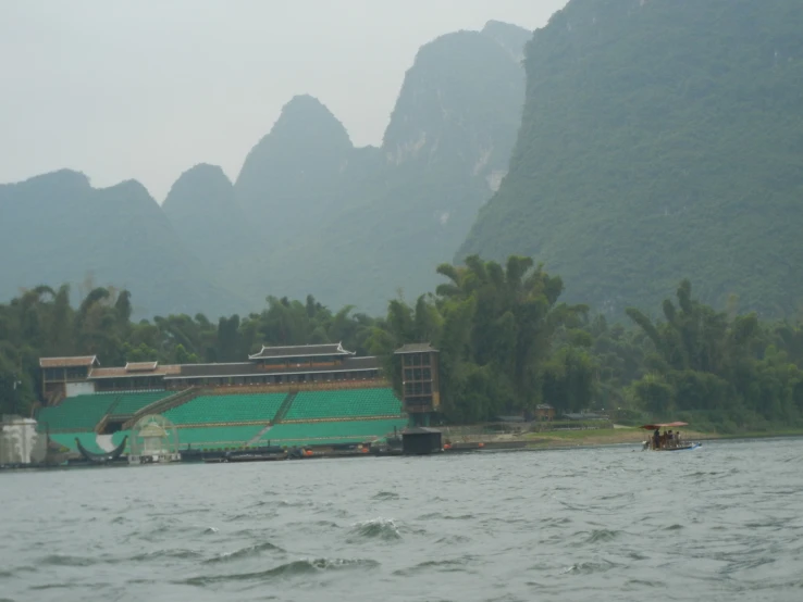 an empty boat in the middle of some water