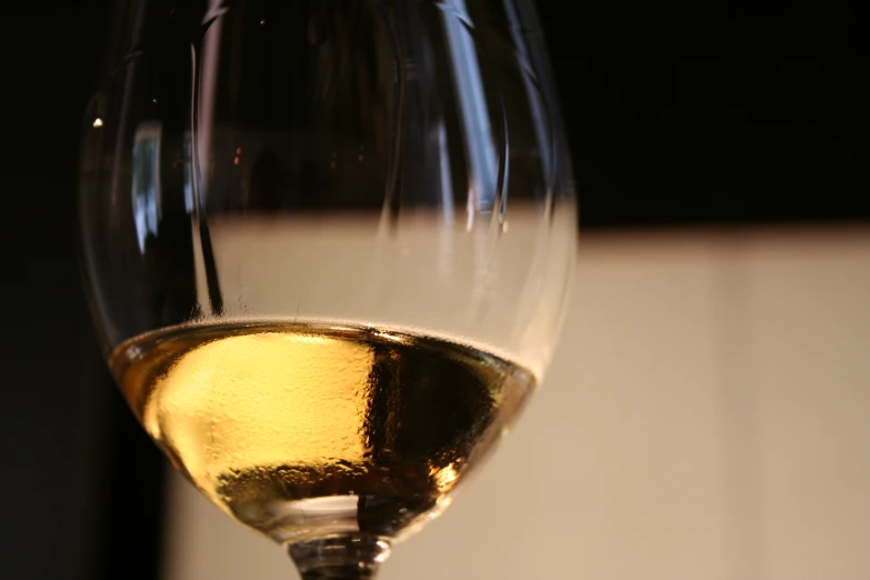 an image of a wine glass that appears to be half empty