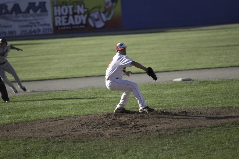 a pitcher is winding up to pitch the ball