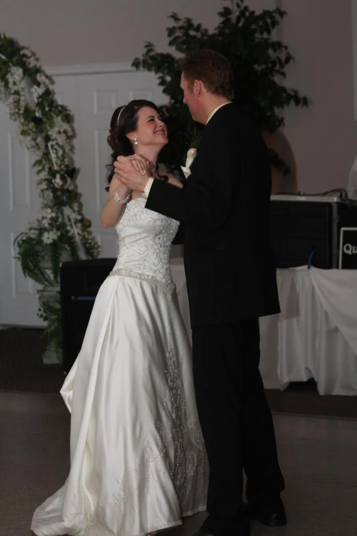 there is a bride and groom dancing together