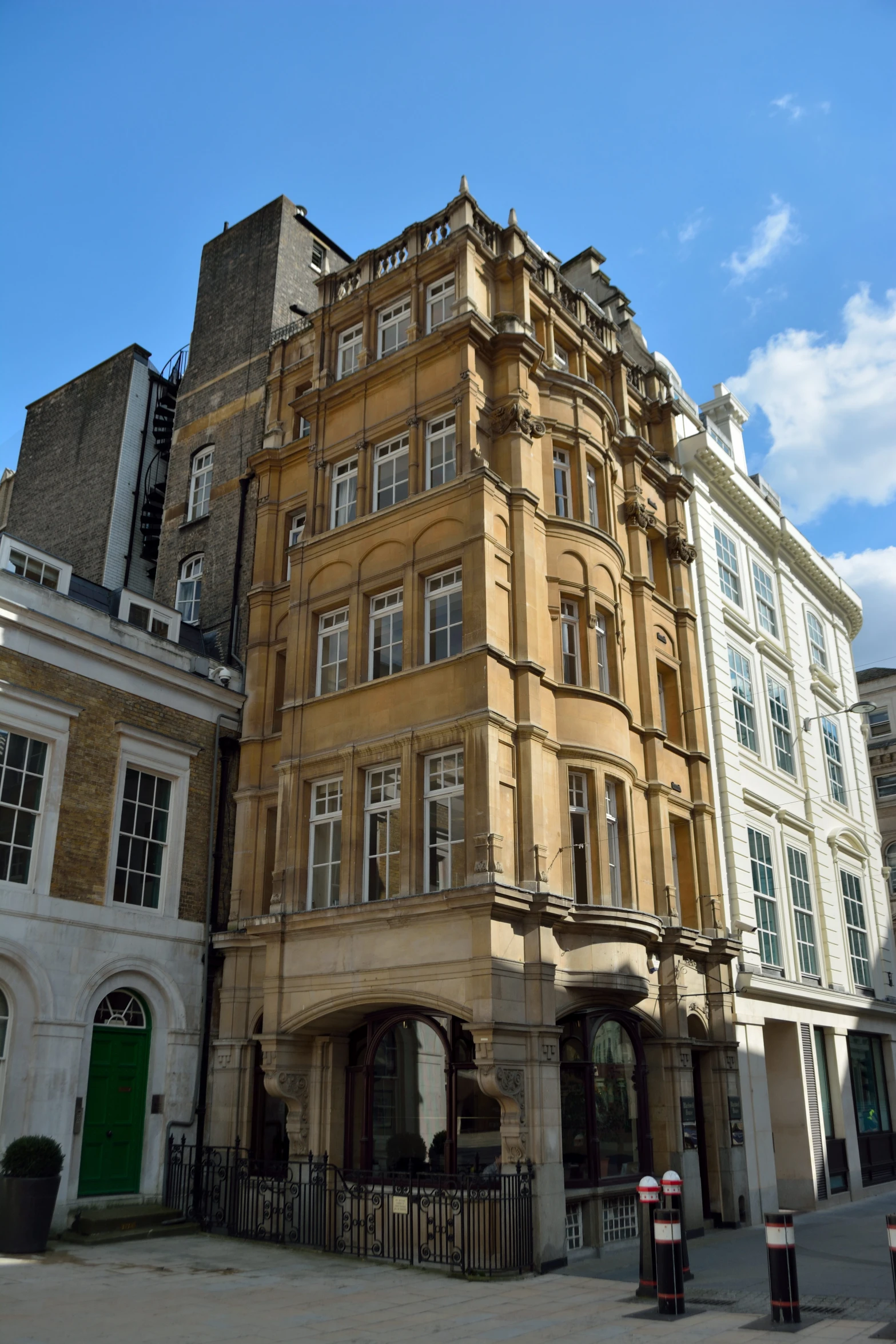 an old building on a side street near some buildings