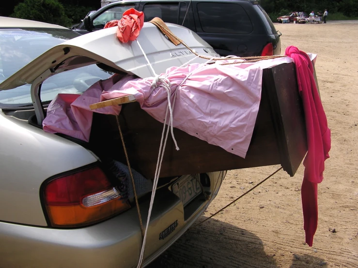 a car that is open with many bags inside