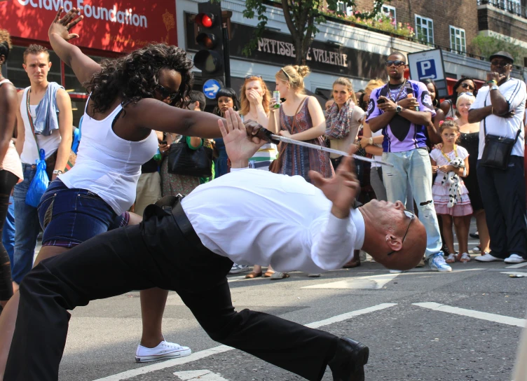 a man performs a street dance on the street