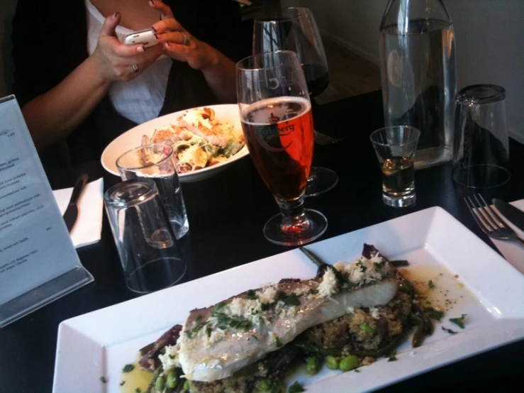 a dish of food sits on a square plate