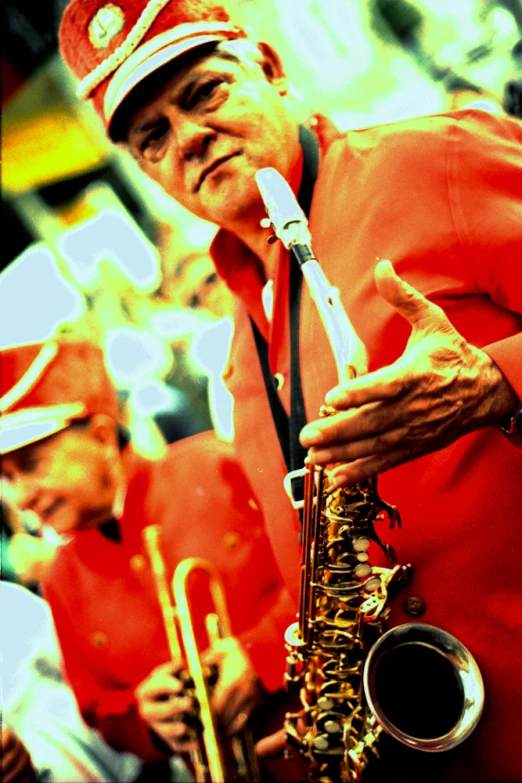 a man in a red outfit playing a musical instrument