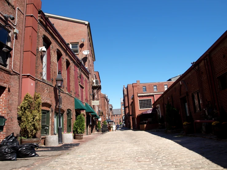 the streets of a town are filled with people walking down them