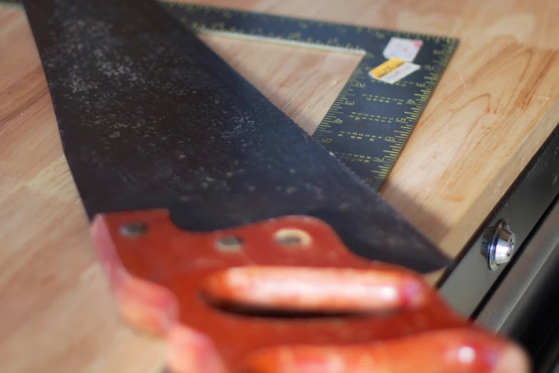 a pair of scissors and some black tape on a table