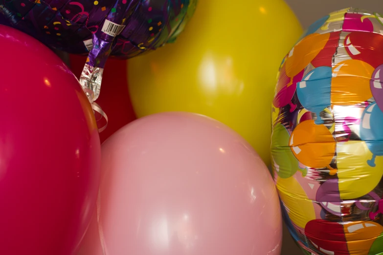 several balloons and streamers on a table