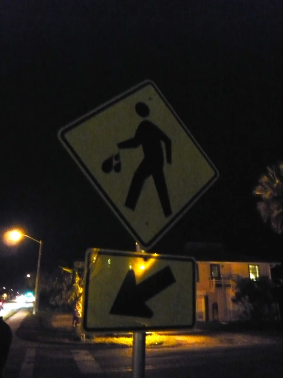 a traffic sign is near an arrow with another sign under it