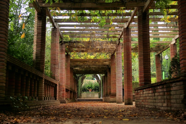 there are several different brick structures with lots of foliage on them