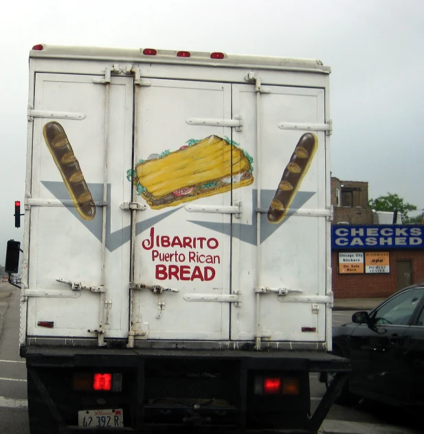 a truck with the back of the semi loaded with food painted on it
