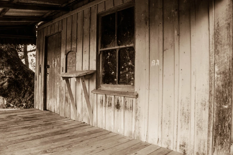 a black and white po of a wooden house