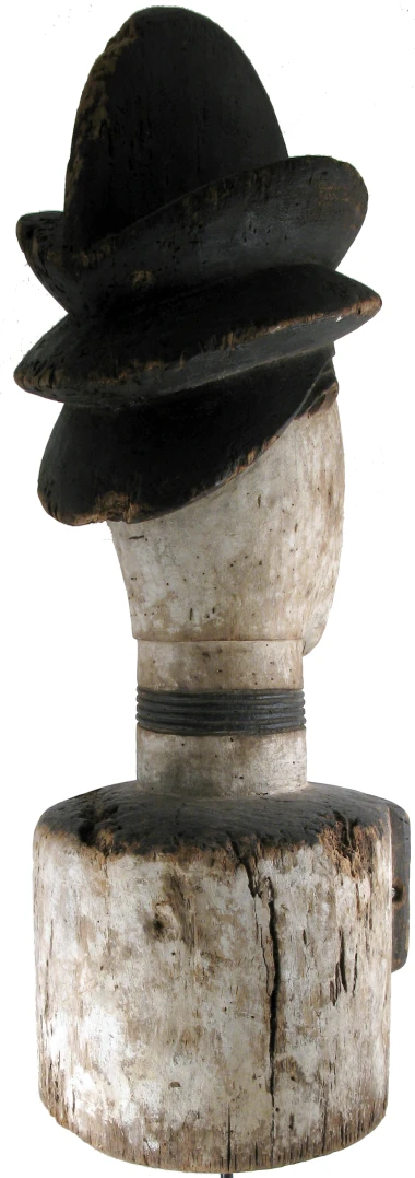 a white piece with a black hat on top