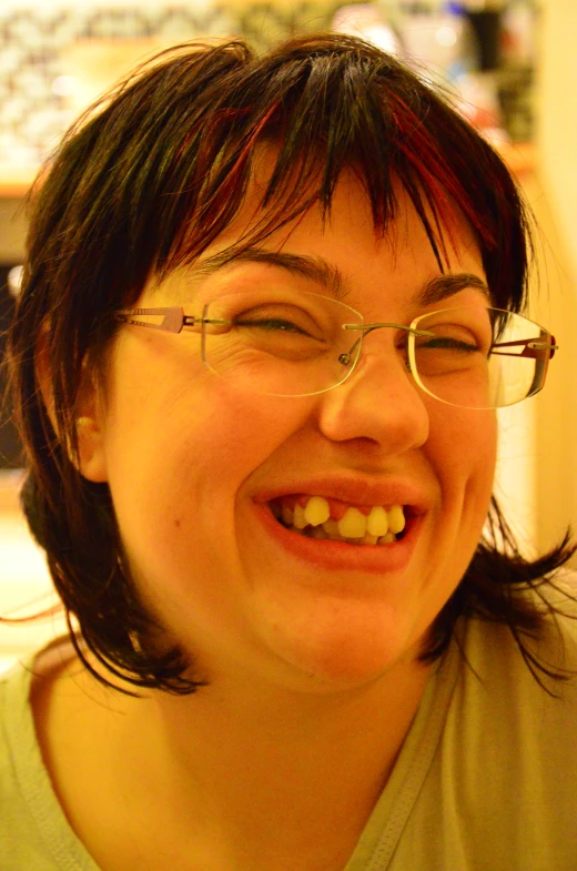 a woman smiling and looking straight ahead