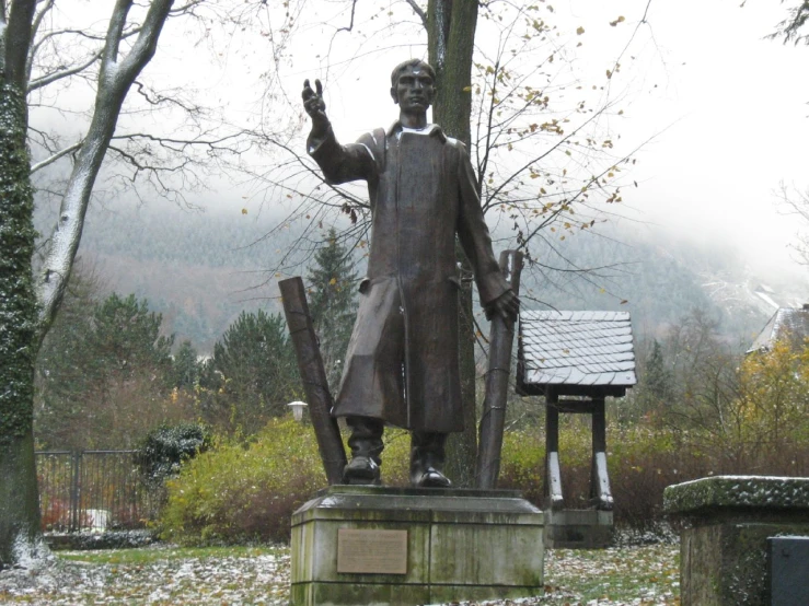 a statue of a person holding soing near him