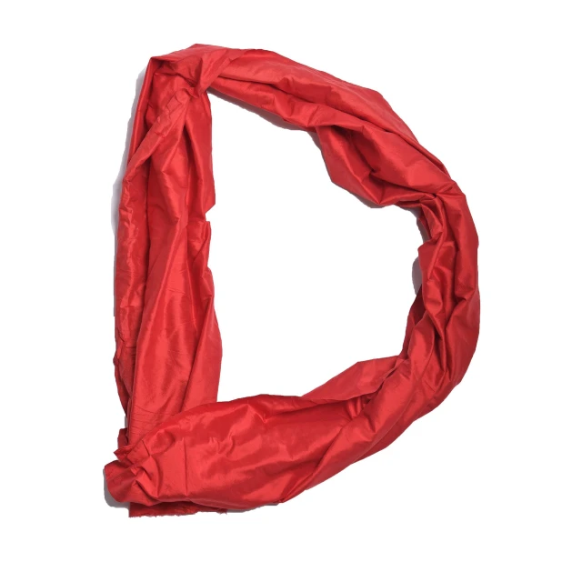 a red scarf is on a white surface