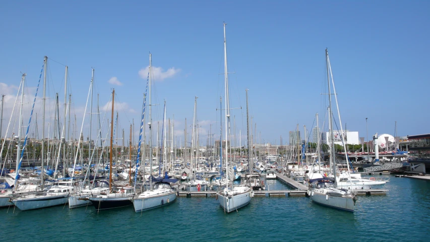 several boats docked in a harbor, one larger and the other smaller