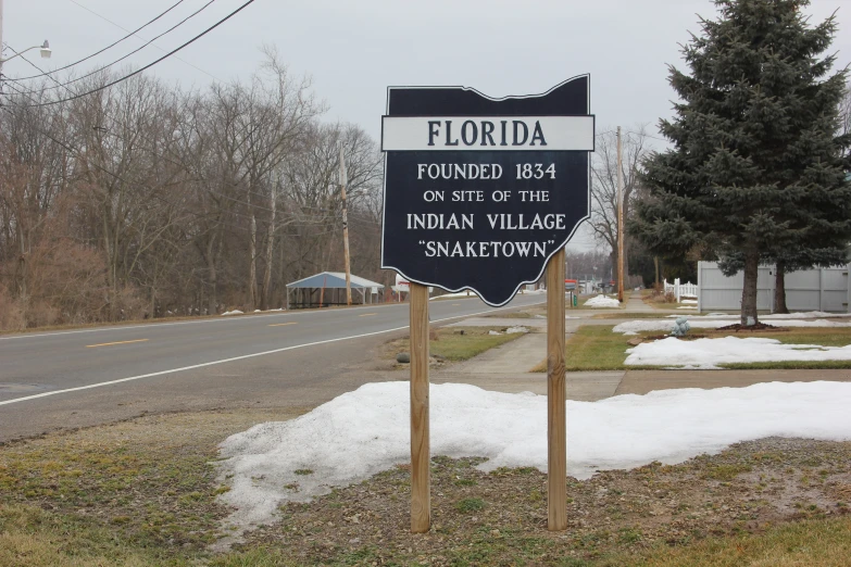 the road sign for flordda is posted on a pole