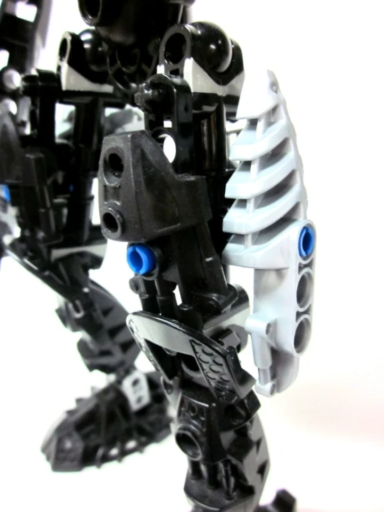 a toy robot with its legs and arms extended