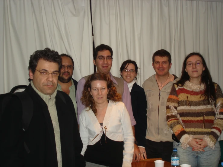 a group of people standing together in a room