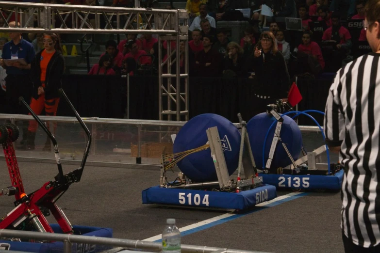 two blue tow boats with safety ropes