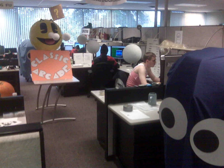 office cubicles are decorated with desk top and office supplies