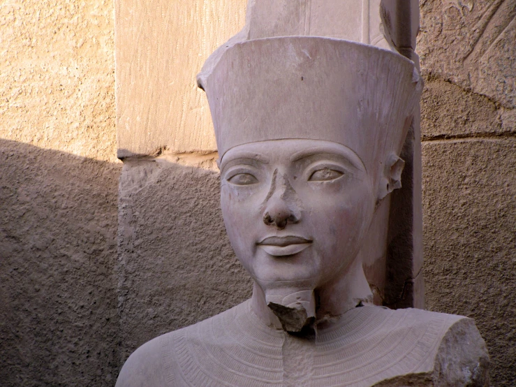 an egyptian statue is seen from close up on the wall