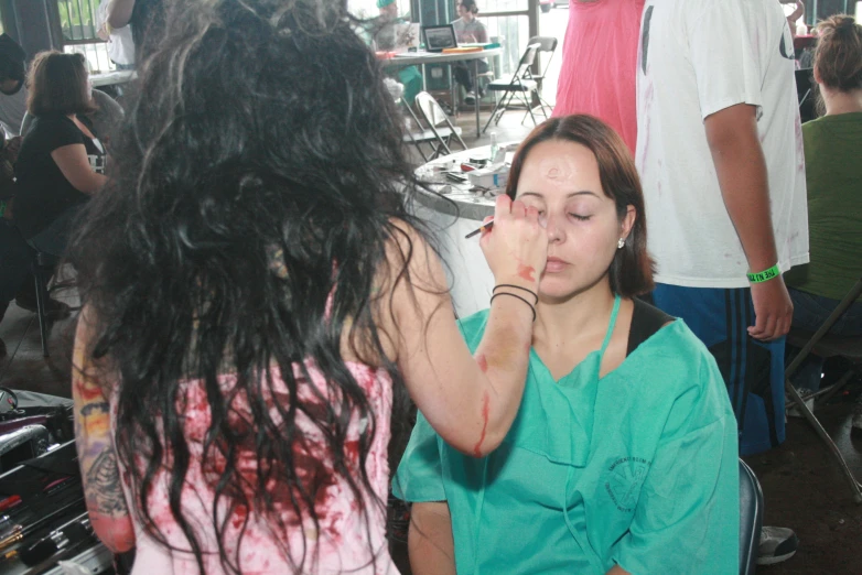 a woman standing in front of other people