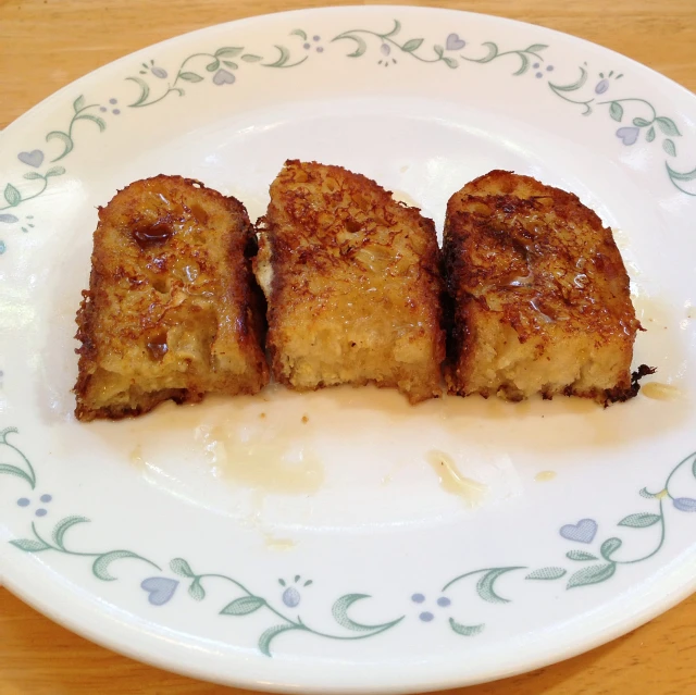 a plate topped with meat covered in a sauce