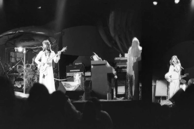 black and white pograph of people playing on stage