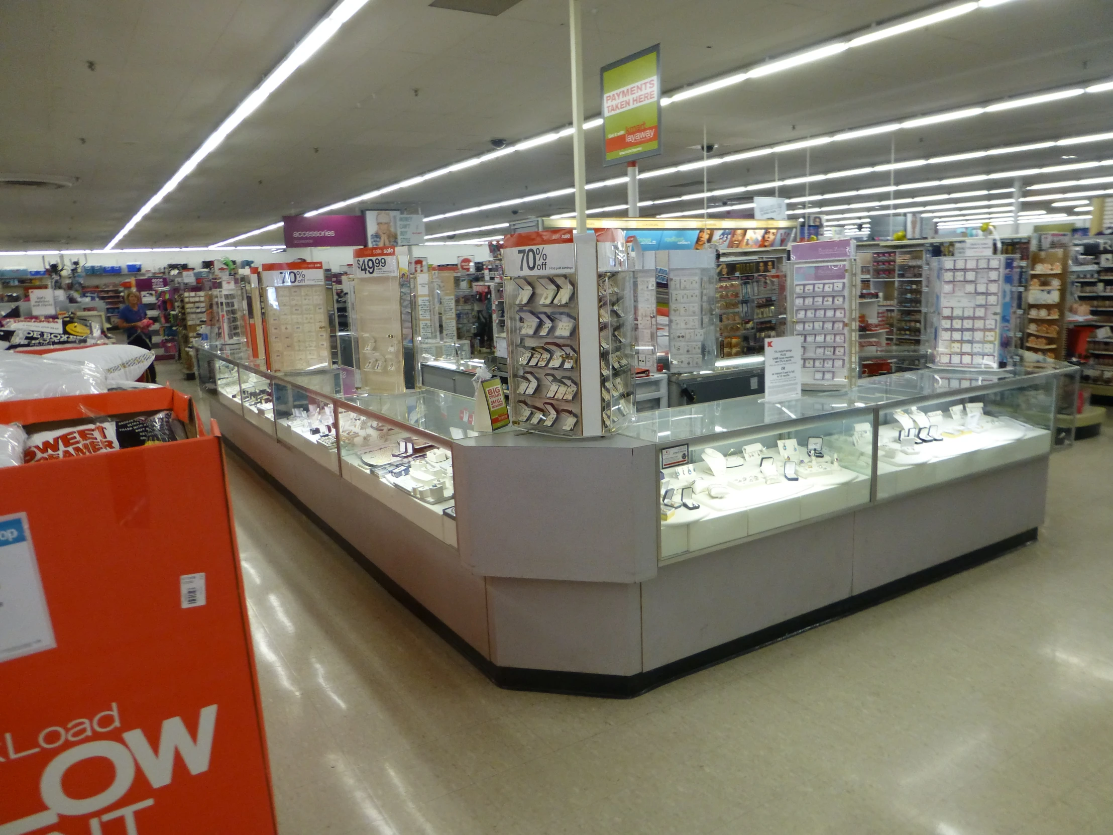 a mall filled with glass shelves filled with items