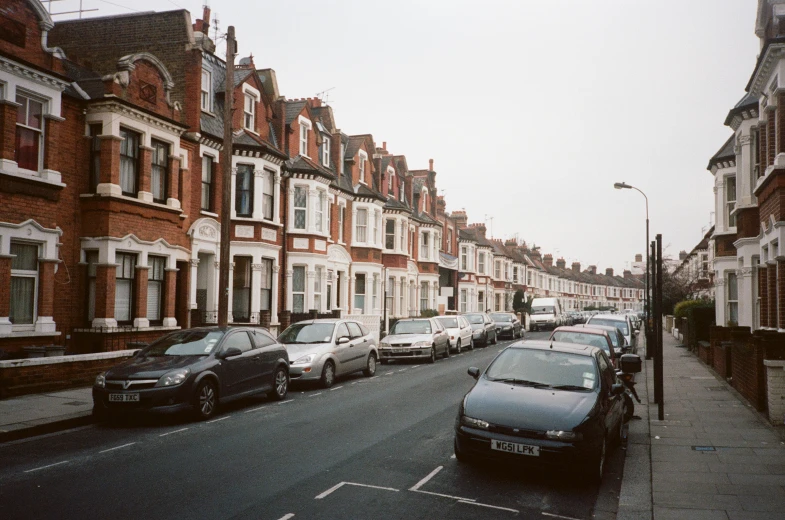 some cars parked on the side of a road