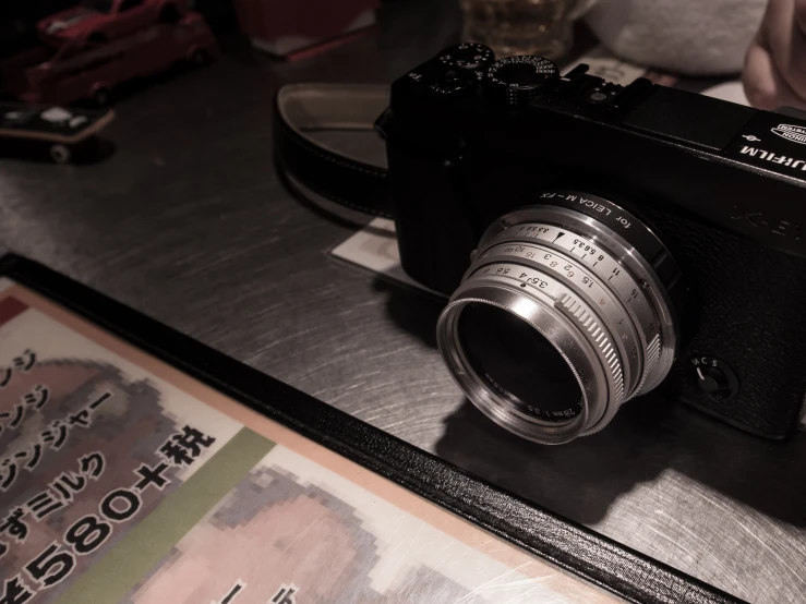 an old fashioned camera with a pointed lens