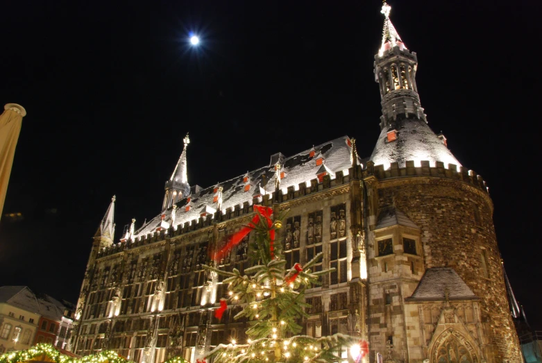 a large building lit up with christmas lights and decorations