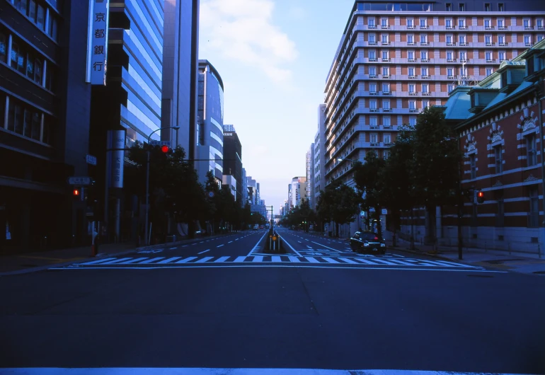 a city street is seen in the evening