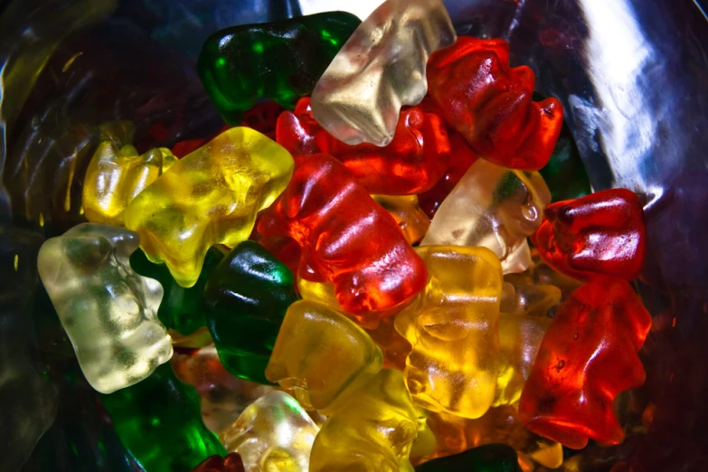 some colorful gummy bears in a bowl